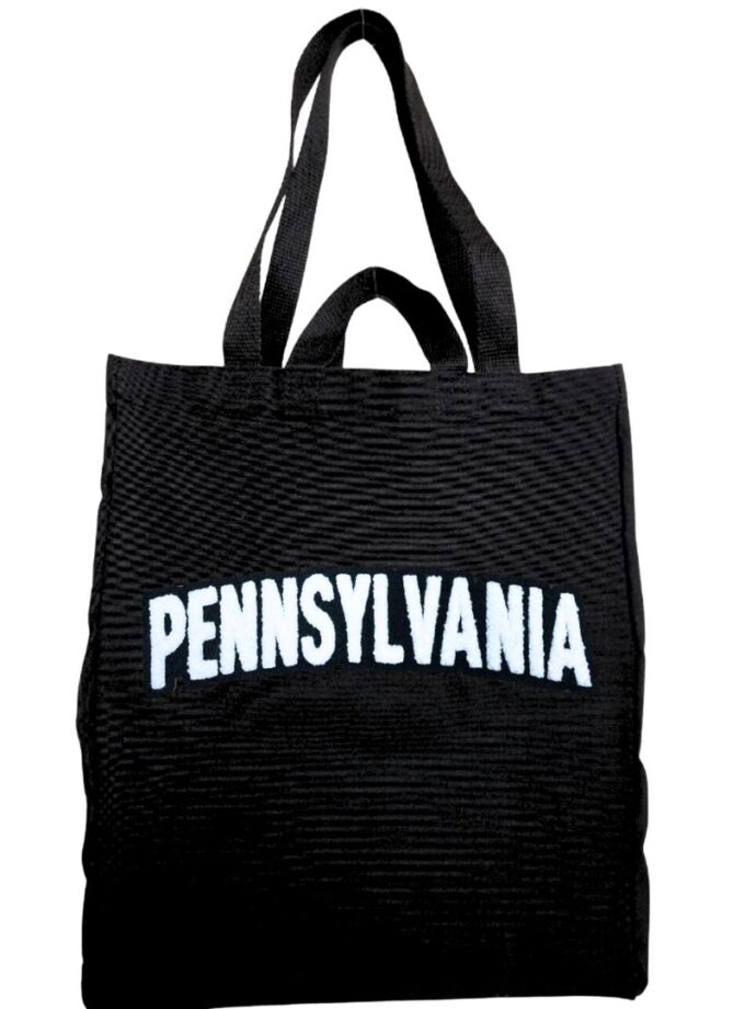 Black tote bag with Pennsylvania in soft, chenille embroidery